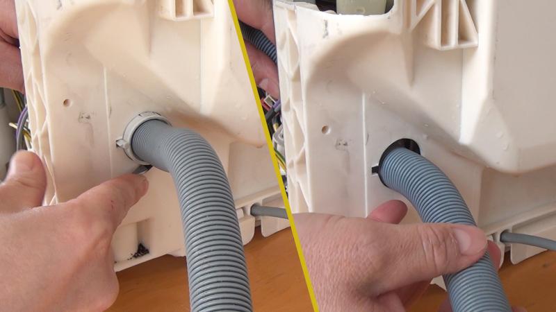 Durchführung des Ablaufschlauchs entriegeln